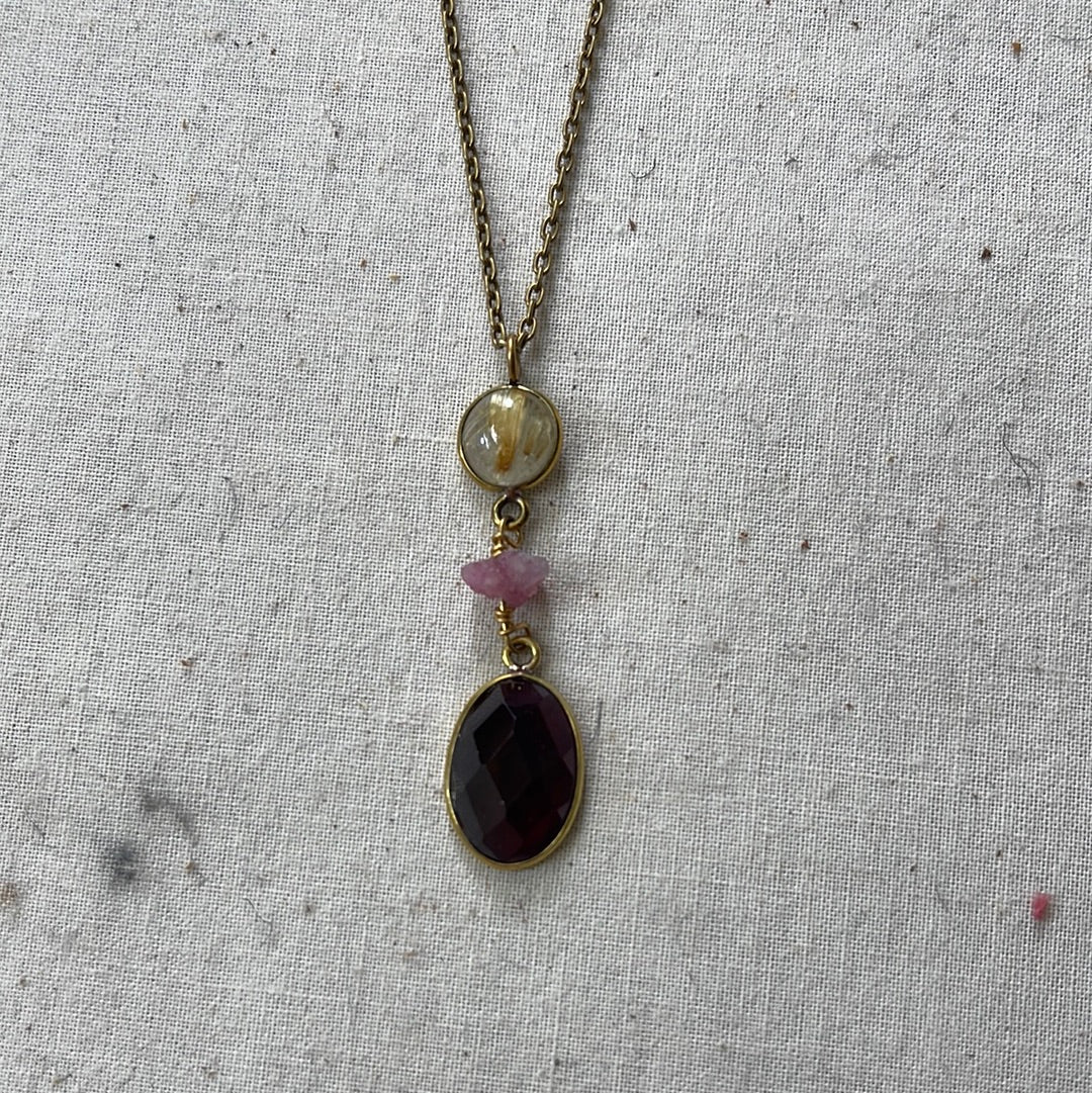 Rutilated quartz, ruby and garnet pendant